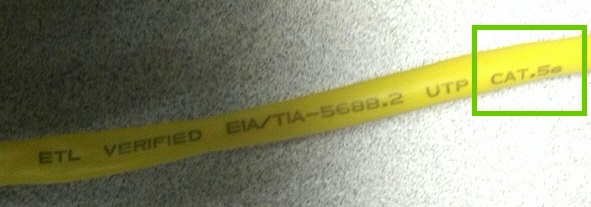 A cat5e ethernet cable with the cable rating printed on it.
